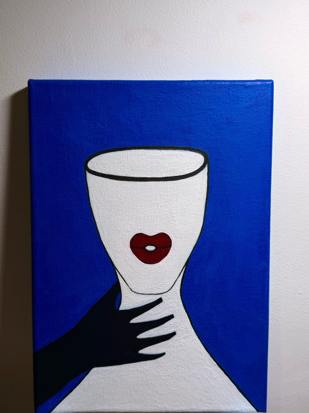 Abstract artwork with a white cup-like shape on a blue background